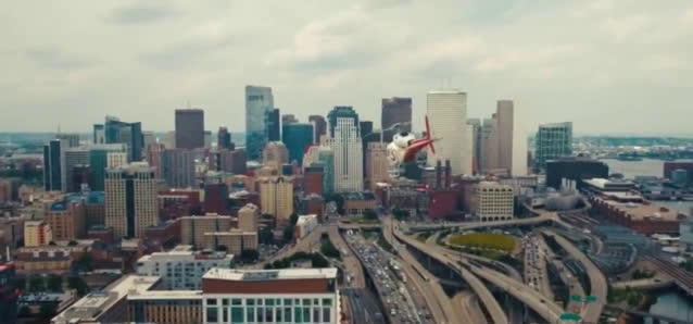  Man eats a cereal while flying in a helicopter
