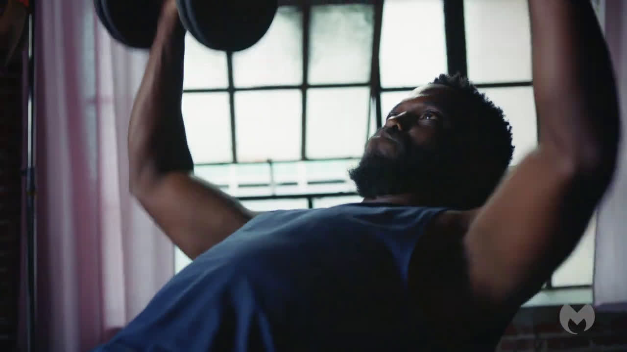  Man videotapes himself at the gym doing exercises