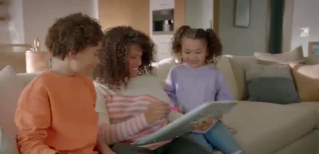  Mother teaching her daughter with her digital whiteboard