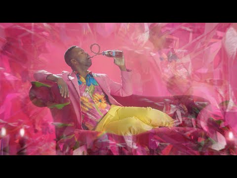  Man shows the red crystals of his new drink