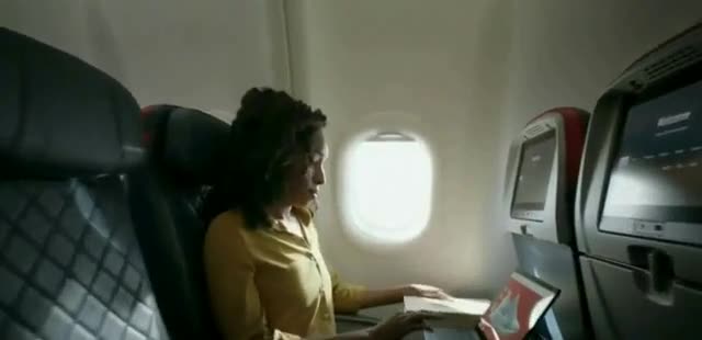  Woman designing shoes with her tablet