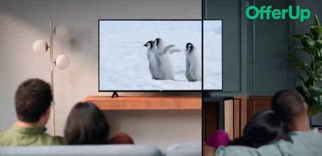  Family watching penguins on the screen