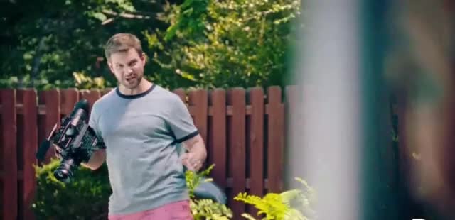 Geico Man videotaping his wife with his professional camera