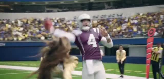  Woman makes a tackle on a football player