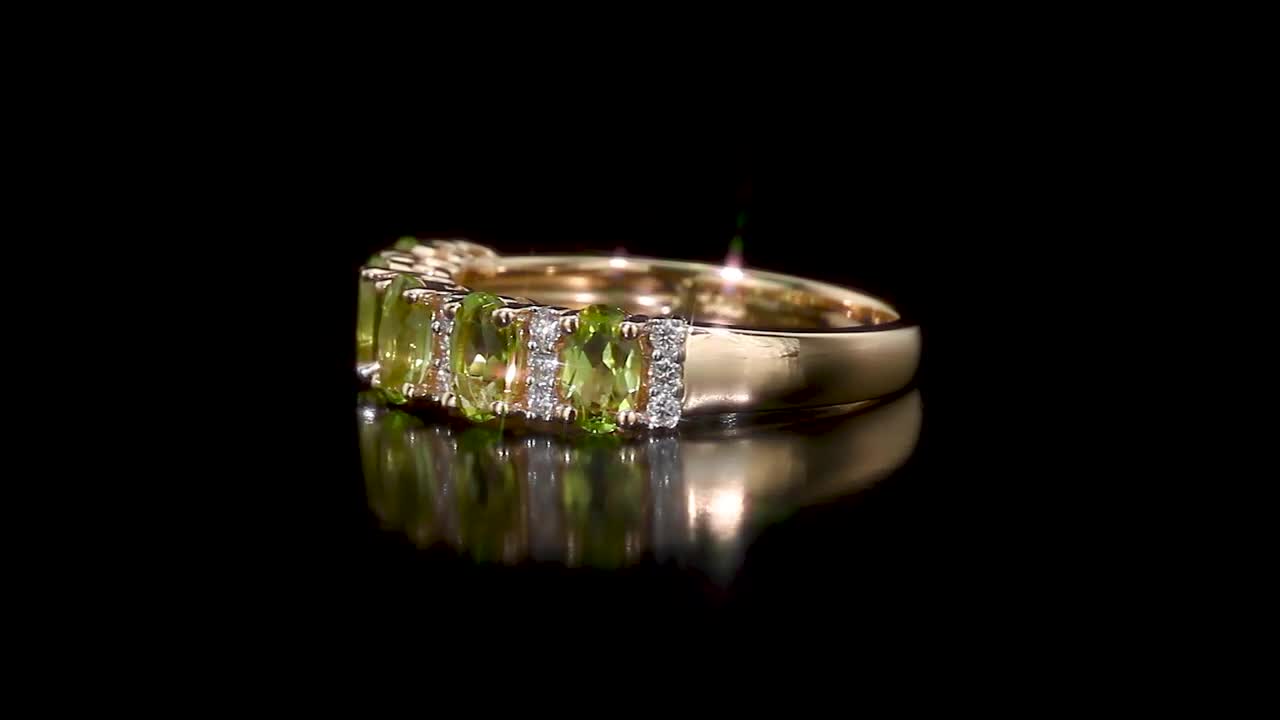 REEDS Jewelers Oval Peridot and 1/6ctw Diamond Yellow Gold Ring