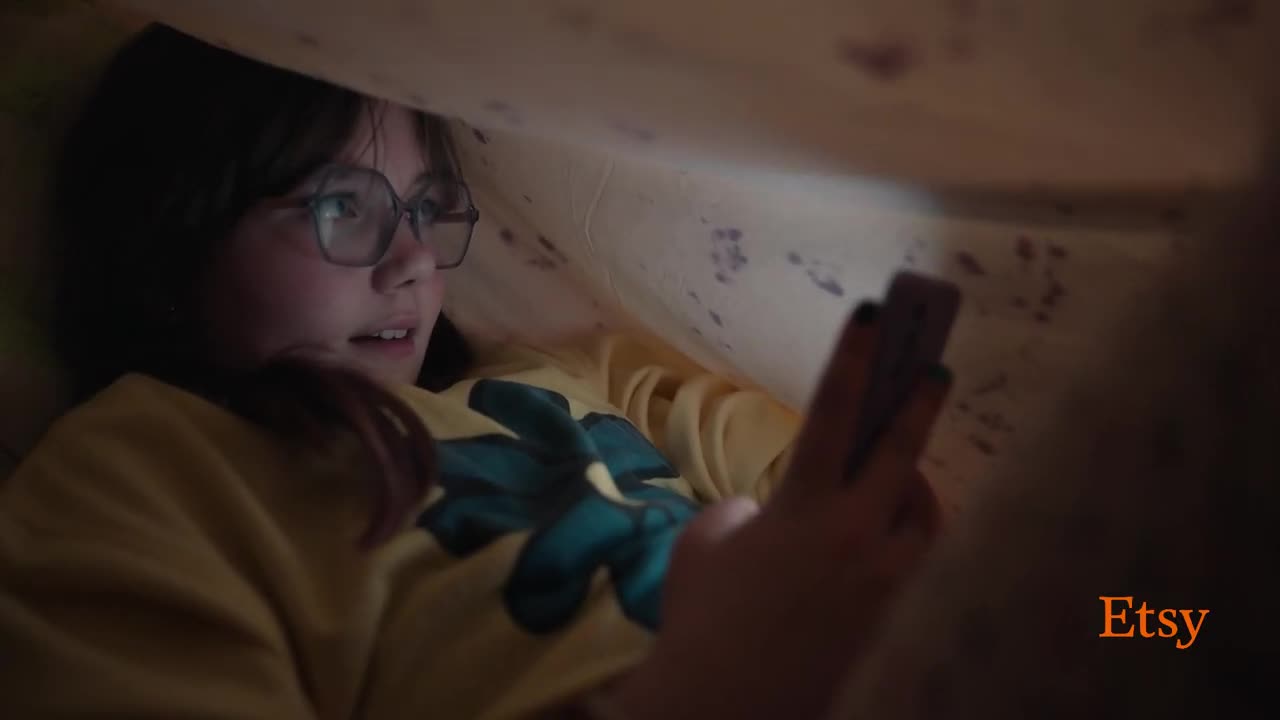  Girl looking at the phone on the sly