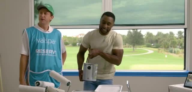 Valspar Man watching a golf game while painting