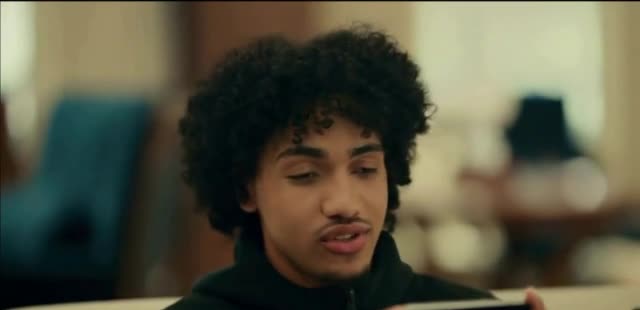 Woman watching a video with Kentucky mascot