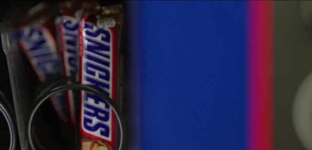 Snickers Man tastes his lips when looking at Snickers