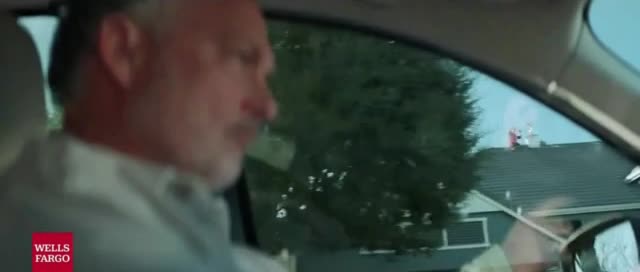 Wells Fargo Man calls for help on top of 