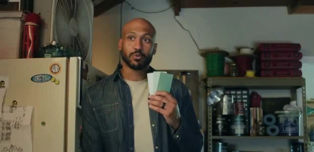  Couple painting their house