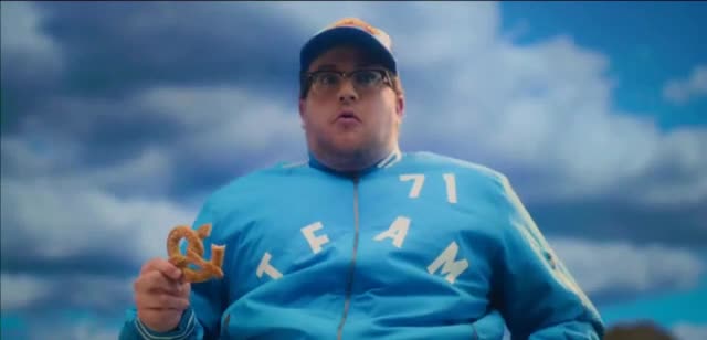 SUPERPRETZEL Man making a pile of objects