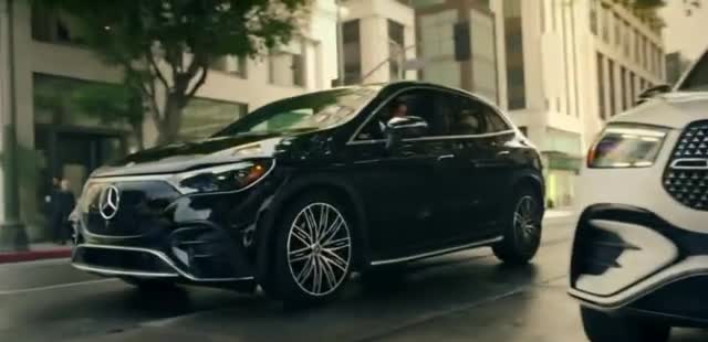 Mercedes Benz Woman charging her electric car