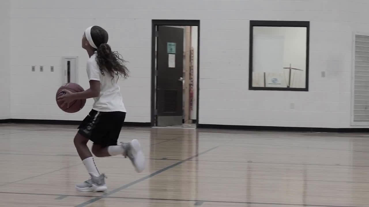 little girl playing basket