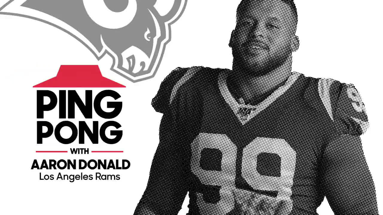  American football player throwing something with pizza in his hand