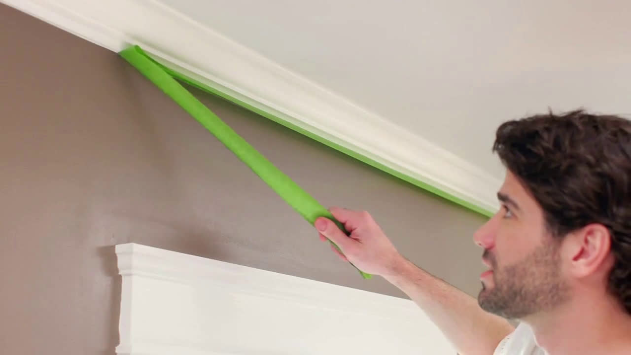  men painting the wall