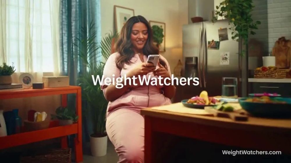 What is the background song in the WeightWatchers program commercial?