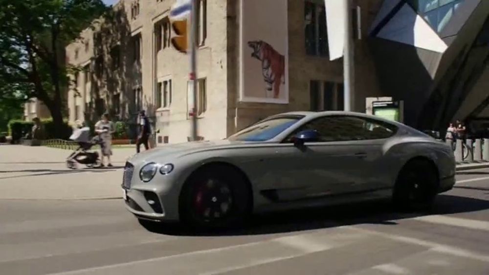 Who appears in the Bentley luxury driving ad?