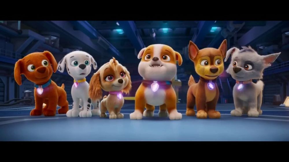 Who sings the theme song for the new Paw Patrol 2026 movie trailer?