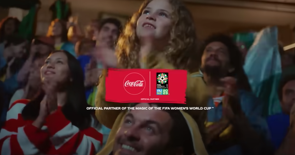 What is the background song in the Coca-Cola Football Magic ad?
